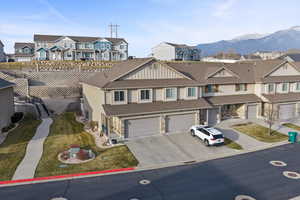 South facing view of front of home featuring mountain views.