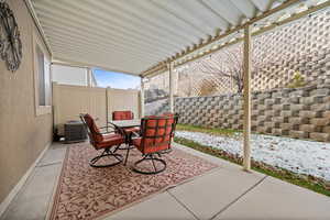 Fenced backyard featuring a patio and outdoor dining space.