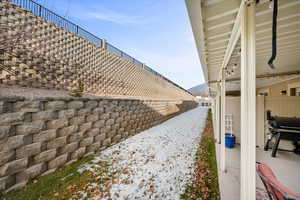 View of side of home with a patio area.