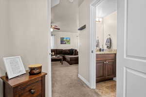 Main hallway with LVP flooring and 1/2 bath.