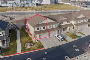 Aerial perspective of suburban area featuring property boundaries highlighted