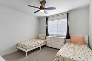 Bedroom with carpet flooring and a ceiling fan