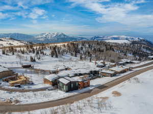 Snowy aerial view with a mountain view