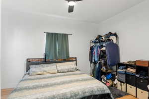 Bedroom featuring ceiling fan and wood finished floors