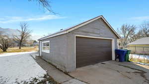 Detached garage featuring a mountain view
