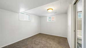 Basement with carpet and baseboards