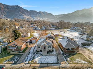 Aerial perspective of suburban area featuring a mountain backdrop