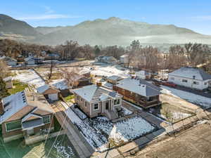 Aerial perspective of suburban area with a mountainous background