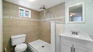Bathroom with vanity and a shower stall
