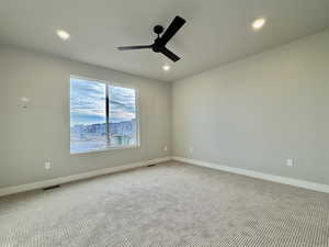 Carpeted spare room with recessed lighting and ceiling fan