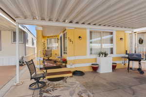 View of patio featuring a grill