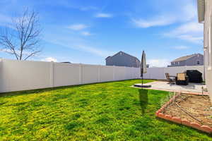 Fenced backyard featuring a patio area