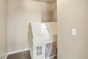 Detailed view of baseboards and carpet floors