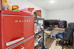 Office with light wood finished floors