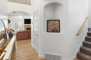 Hall with stairway and light wood-style flooring