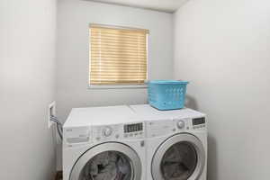 Laundry area featuring separate washer and dryer
