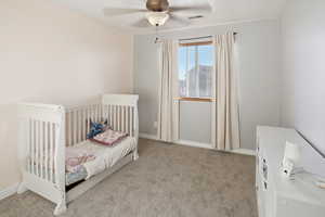 Bedroom featuring light carpet and ceiling fan