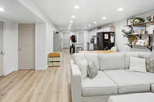 Living room featuring recessed lighting and light wood finished floors