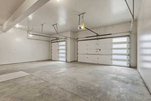 Garage featuring a garage door opener