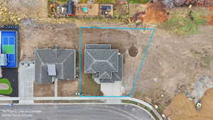 Aerial view of property and surrounding area featuring property parcel outlined