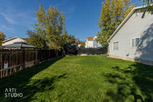 View of fenced backyard