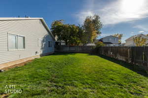 View of fenced backyard