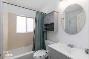 Bathroom featuring vanity and shower / tub combo