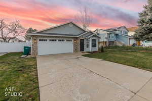View of front facade featuring brick siding, concrete driveway, and a garage