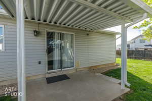 Entrance to property with a patio