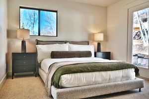 Carpeted bedroom with baseboards