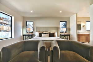 Bedroom featuring connected bathroom and recessed lighting