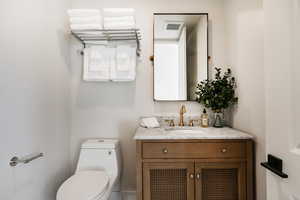 Bathroom featuring toilet and vanity