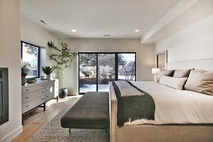 Bedroom featuring light wood finished floors, access to outside, and recessed lighting