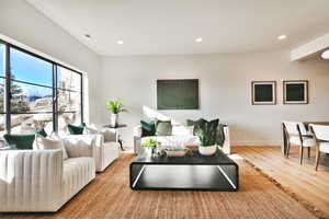 Living area featuring recessed lighting and light wood-type flooring