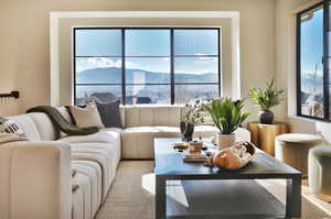 Living area featuring a mountain view and plenty of natural light
