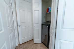 Laundry room featuring light tile patterned floors