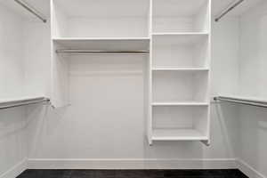 Walk in closet featuring dark tile patterned flooring