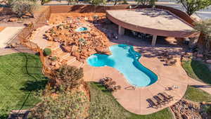 Community pool featuring a patio