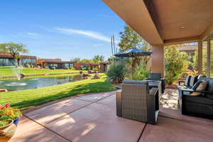 View of patio / terrace featuring a water view and an outdoor living space