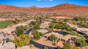 Aerial view of residential area featuring a mountainous background