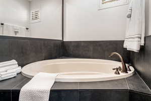 Full bathroom with a garden tub