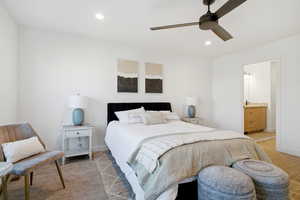 Bedroom featuring recessed lighting, a ceiling fan, and ensuite bath