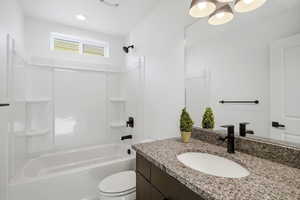 Bathroom with bathtub / shower combination and vanity