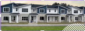 Modern farmhouse style townhome featuring stone siding, a residential view, and board and batten siding