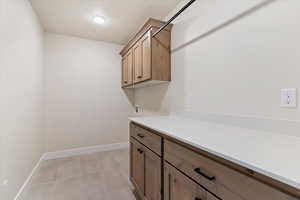 Laundry room with cabinets and countertop