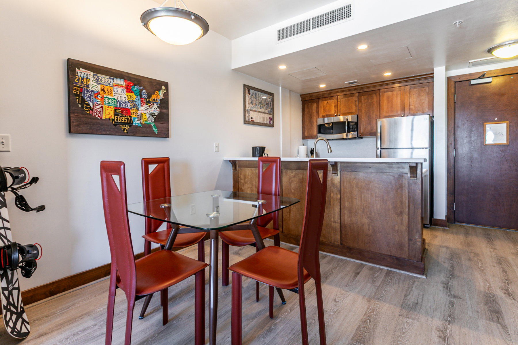 Dining area with recessed lighting and light wood finished floors