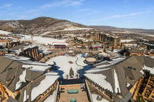 Snowy aerial view featuring a mountain view