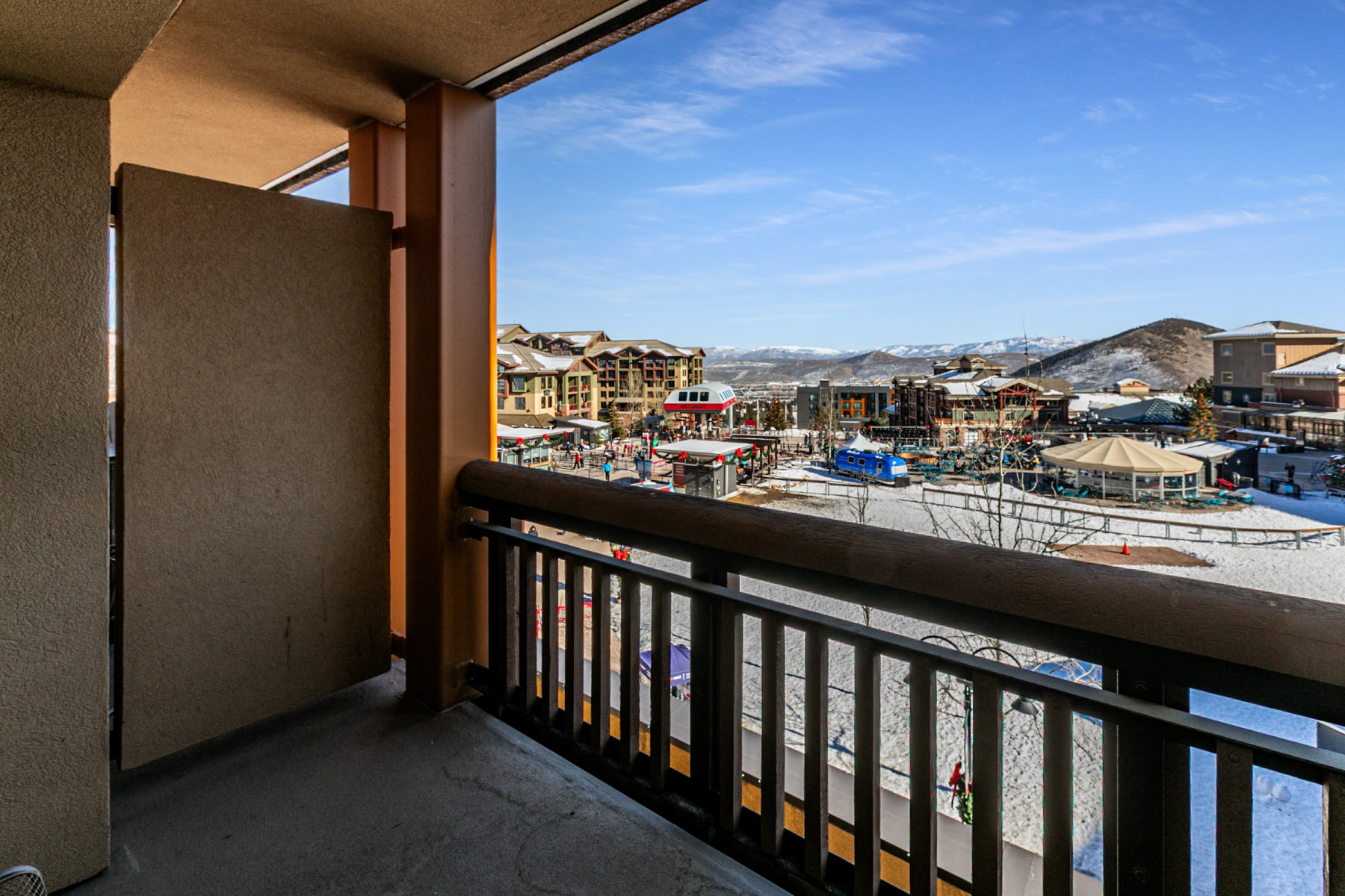 Snow covered back of property featuring a mountain view