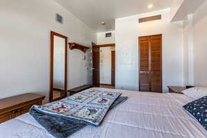 Bedroom featuring a closet and electric panel