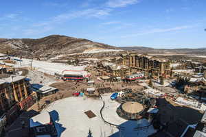 Snowy aerial view with a mountain view